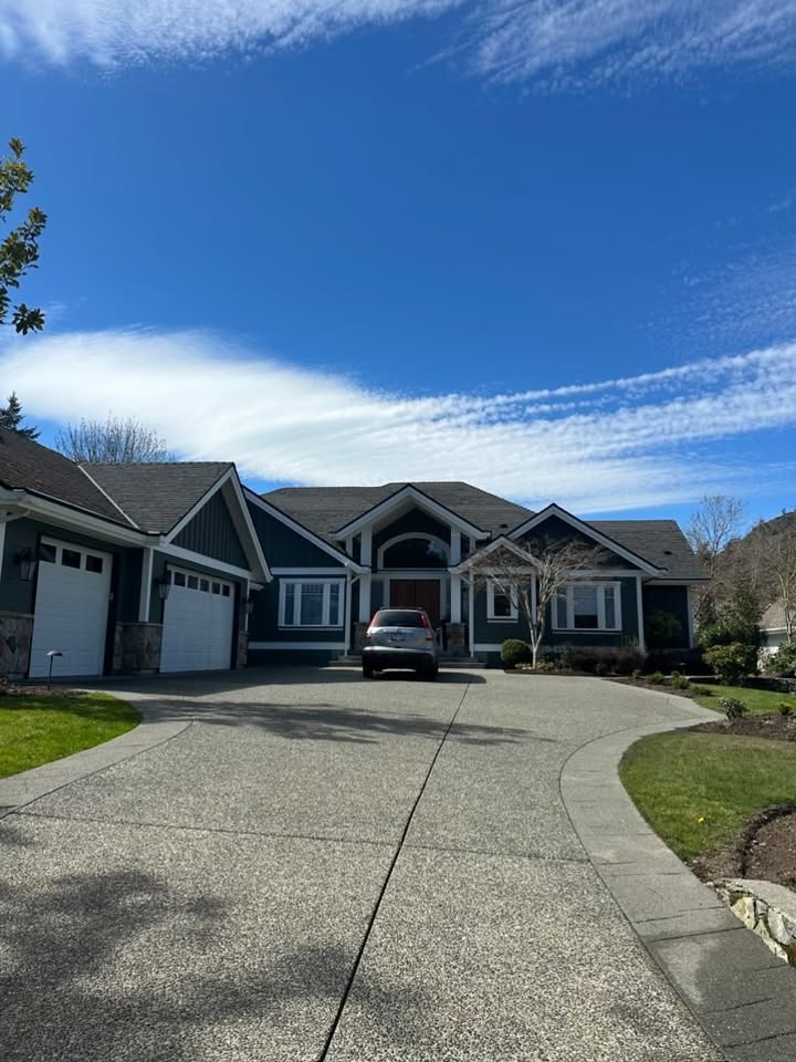 Professional pressure washing service on luxury home